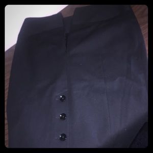 Black tight skirt with buttons on the back.